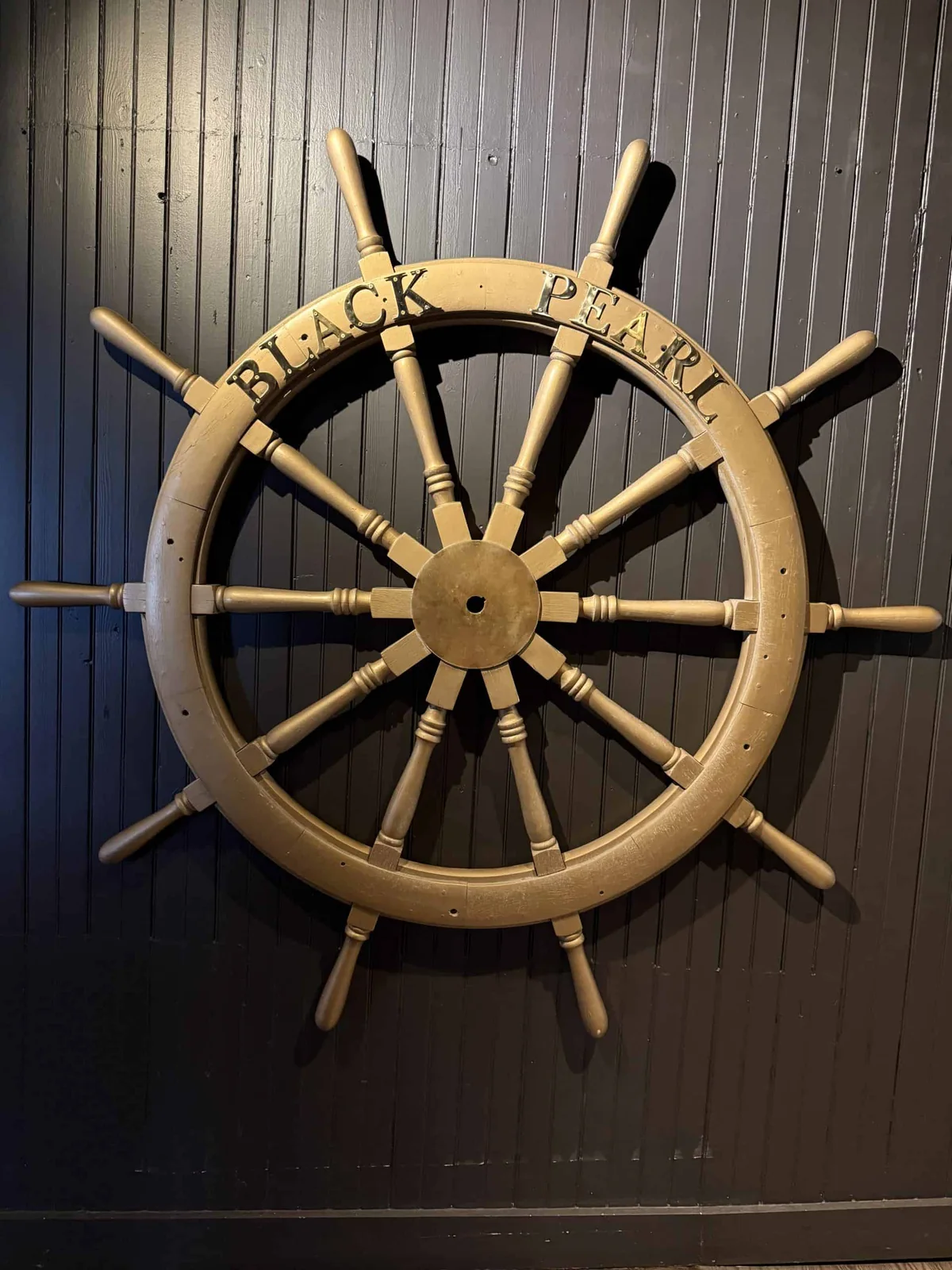 The Black Pearl dining room and ship's wheel